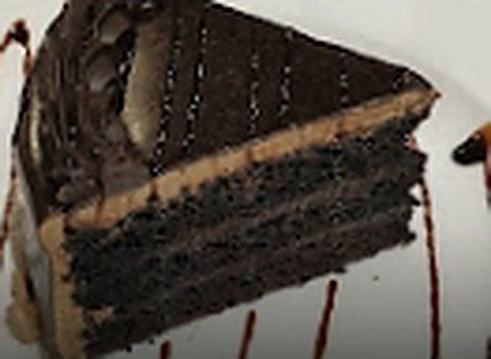 Slice of Chocolate Heavenly Cake with chocolate drizzle