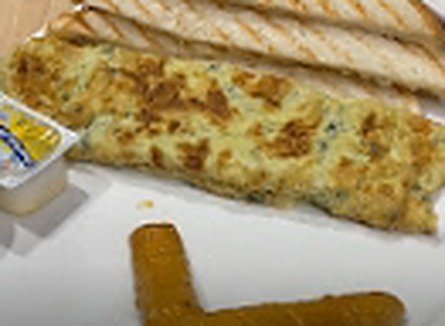 Spanish Omelette with toasted bread on a white plate