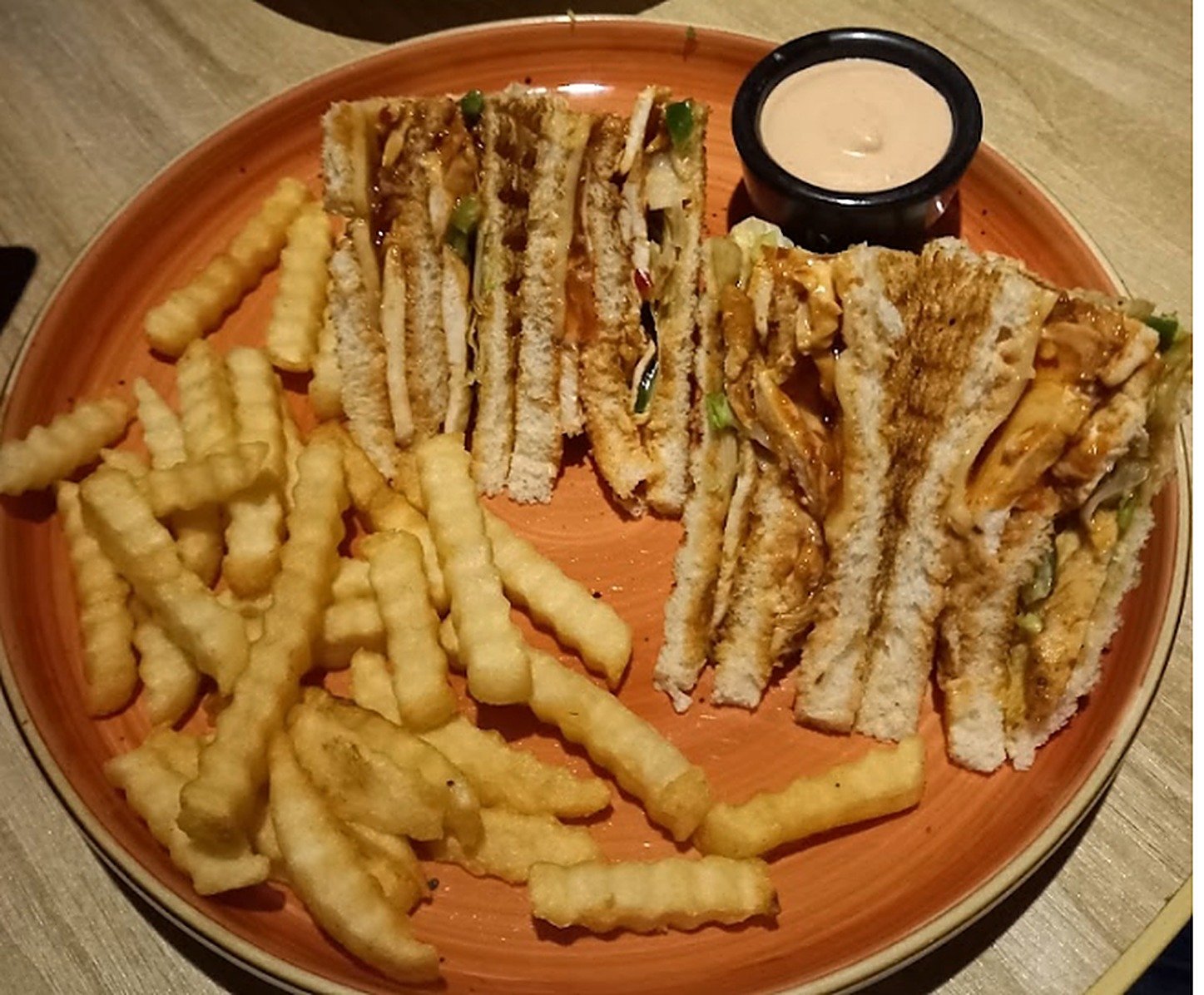 Chicken Tikka club sandwich with crinkle fries and dip