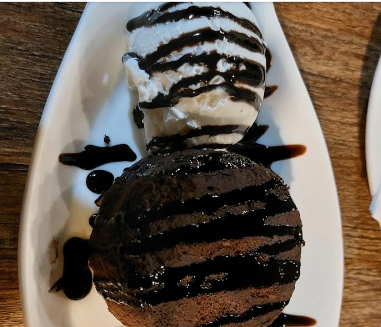 Chocolate molten lava cake with vanilla ice cream and chocolate sauce