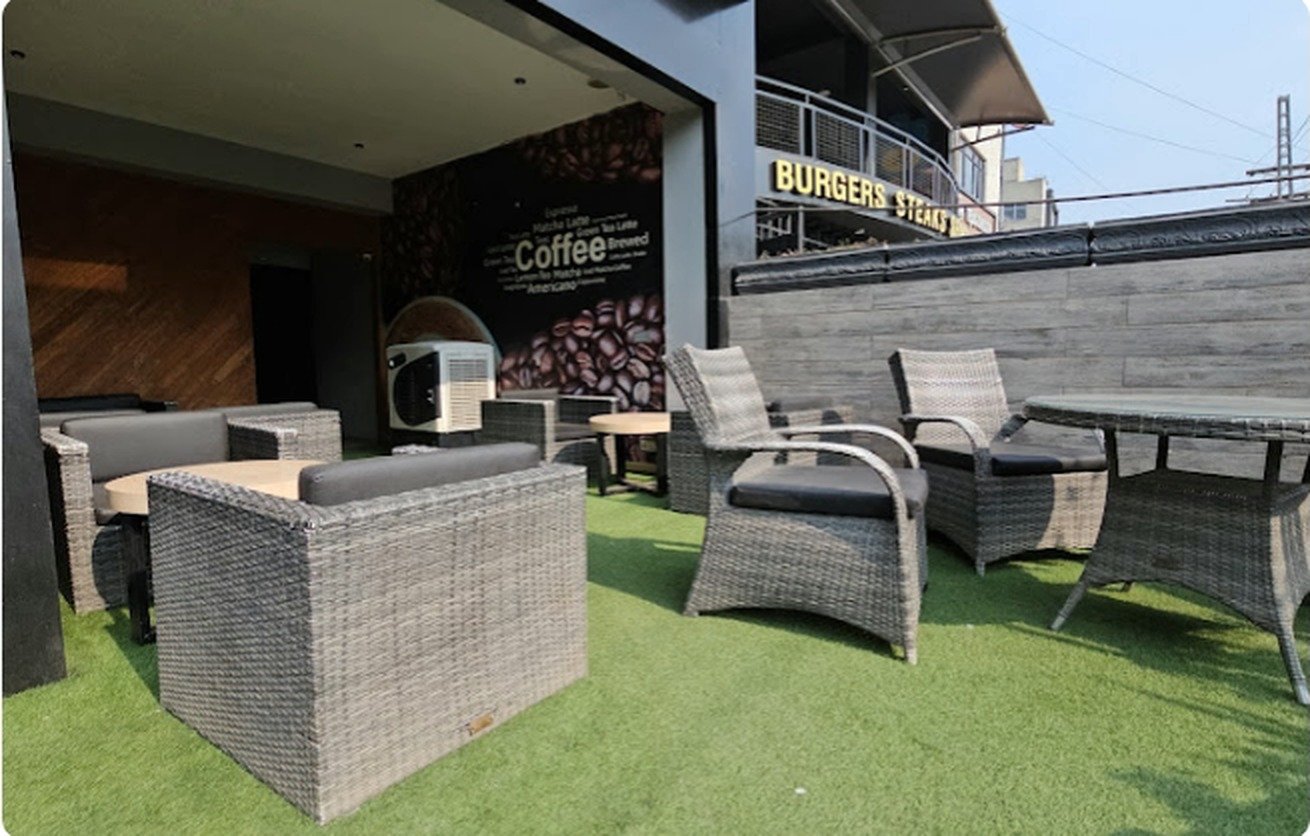 Rooftop terrace with rattan seating at Second Cup Johar Town